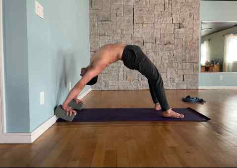 Man bending backwards in a yoga pose